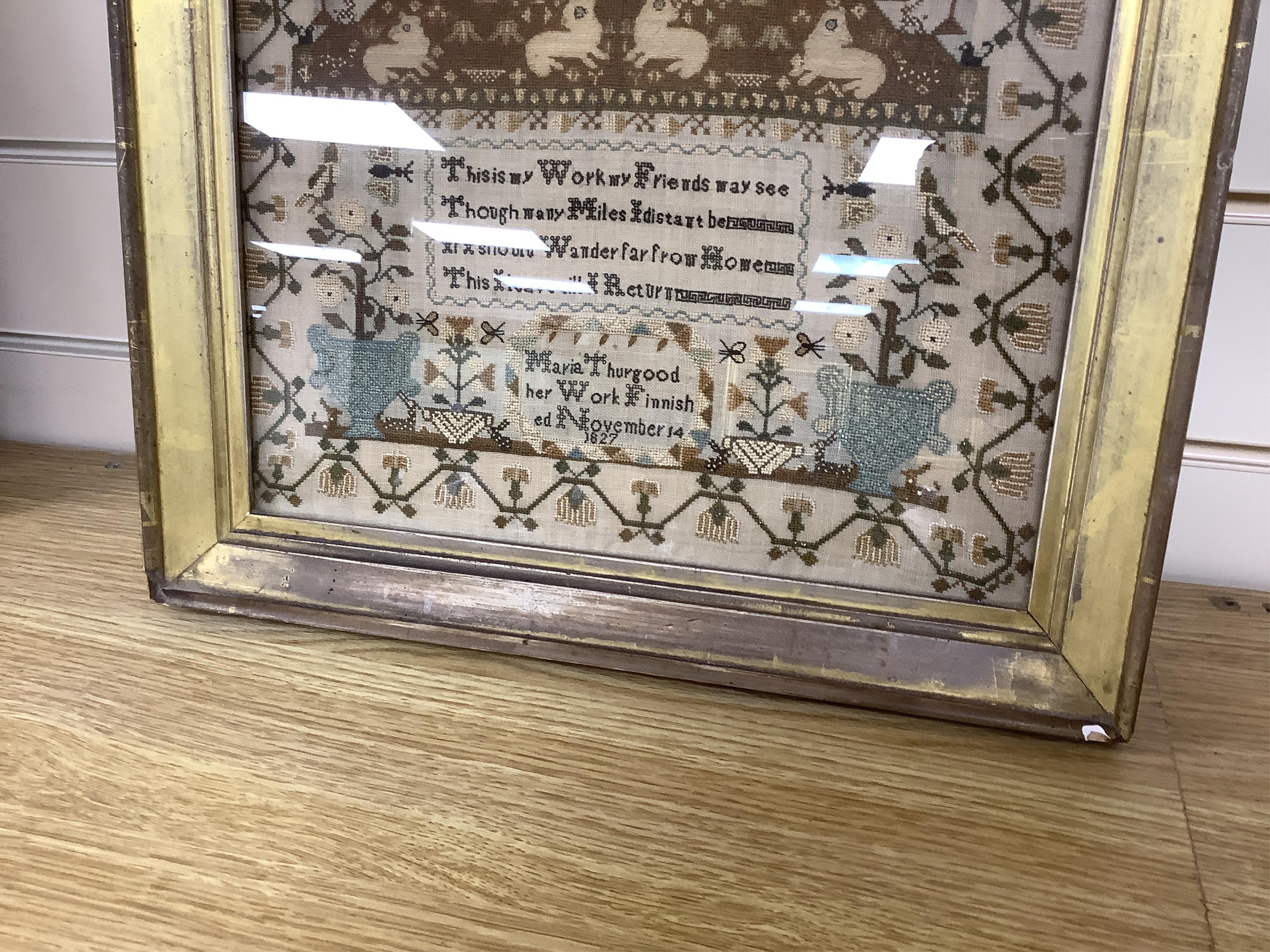 A finely worked sampler by Maria Thurgood, dated 14th November 1827. The sampler packed with finely embroidered motifs, the central motif of a large altar with lambs of God surrounded by motifs of birds, butterflies, rab